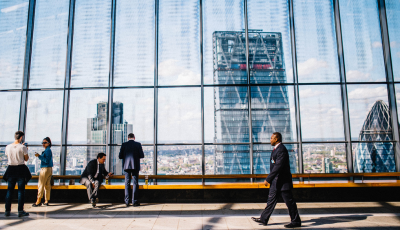 21 Global Office Building with Employees Walking